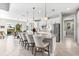 Spacious kitchen and dining area featuring an island with seating and views of the pool at 10491 Sarasota Rd, Port Charlotte, FL 33981