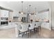 Bright kitchen featuring white cabinets, stainless steel appliances, and seating at the island at 10491 Sarasota Rd, Port Charlotte, FL 33981