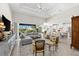 Spacious living room boasting high ceilings, tile floors, and expansive windows for natural light at 10491 Sarasota Rd, Port Charlotte, FL 33981