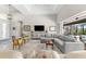 Inviting living room with ample seating, a large TV, and access to the outdoor living space at 10491 Sarasota Rd, Port Charlotte, FL 33981