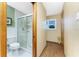 Well-lit bathroom with a glass-enclosed shower and modern fixtures at 1052 Newton St, Englewood, FL 34224