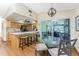 Spacious kitchen island with bar stool seating and sliding glass doors leading to the screened patio at 1052 Newton St, Englewood, FL 34224