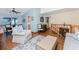 Comfortable living room with wooden floors, high ceilings, and a view of the screened in patio at 1052 Newton St, Englewood, FL 34224