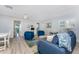 Inviting living room with blue accents and view to an outdoor pool, providing a cozy atmosphere at 1052 Newton St, Englewood, FL 34224