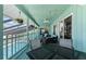 Spacious, covered patio with outdoor seating area, views of the pool, and ceiling fans at 1052 Newton St, Englewood, FL 34224