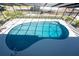 Enjoy this kidney-shaped, screened-in pool with beautiful, sparkling blue water at 1052 Newton St, Englewood, FL 34224