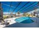 Enjoy swimming in this screened-in pool with patio space and views of the canal at 1052 Newton St, Englewood, FL 34224