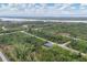 An aerial view of the house with a beautiful river view at 10782 Kearsarge Cir, Port Charlotte, FL 33981