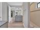 Bathroom featuring dual sinks, granite countertops, modern fixtures, and a glass-enclosed shower at 10782 Kearsarge Cir, Port Charlotte, FL 33981