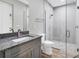 Bathroom featuring granite countertop, modern fixtures, a glass shower and tile flooring at 10782 Kearsarge Cir, Port Charlotte, FL 33981