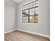 Bright bedroom with a large window allowing lots of natural light, complemented by new laminate wood flooring at 10782 Kearsarge Cir, Port Charlotte, FL 33981