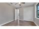 Comfortable bedroom featuring a ceiling fan and ample closet space for storage at 10782 Kearsarge Cir, Port Charlotte, FL 33981