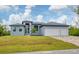 Charming single-Gathering home with well-maintained lawn and a two-car garage in a serene neighborhood at 10782 Kearsarge Cir, Port Charlotte, FL 33981