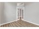 Inviting living room with new laminate flooring, fresh paint, and elegant french doors leading to another room at 10782 Kearsarge Cir, Port Charlotte, FL 33981
