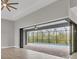 Spacious living area featuring large sliding doors to a screened pool, providing ample natural light at 10782 Kearsarge Cir, Port Charlotte, FL 33981