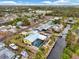 Aerial view of the house showcasing the pool, canal access, and neighborhood at 1173 Brown St, Englewood, FL 34224