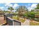 Waterfront back yard with landscaped lawn, brick walkway to the boat dock on the canal at 1173 Brown St, Englewood, FL 34224