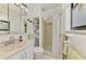 Clean bathroom with neutral tones featuring a shower and vanity at 1173 Brown St, Englewood, FL 34224