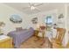 Charming bedroom with a twin bed, rocking chair, and nautical decor at 1173 Brown St, Englewood, FL 34224