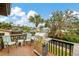 Spacious outdoor deck with a grill, seating, and a water view at 1173 Brown St, Englewood, FL 34224
