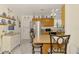 Bright kitchen featuring stainless steel appliances, a cozy breakfast bar, and tasteful blue and white decorative accents at 1173 Brown St, Englewood, FL 34224