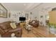 Bright living room featuring hardwood floors, comfortable seating, and stylish decor at 1173 Brown St, Englewood, FL 34224