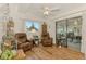Cozy sunroom with comfortable seating, bright window, and glass sliding door offering a tranquil view at 1173 Brown St, Englewood, FL 34224