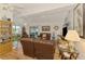 Cozy living room with hardwood floors, ceiling fans, and comfortable leather furniture at 1173 Brown St, Englewood, FL 34224