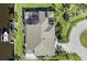 An aerial shot of the homes roof, screened-in patio, boat dock and waterfront views at 12432 Nova Ave, Port Charlotte, FL 33981