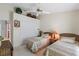 Comfortable bedroom featuring neutral tones, twin beds, closet space, and a ceiling fan at 12432 Nova Ave, Port Charlotte, FL 33981