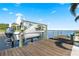 Dock with boat lift, offering direct access to the open water and waterfront views at 12432 Nova Ave, Port Charlotte, FL 33981