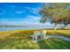 Scenic community park with bench overlooking the water, perfect for relaxation and enjoying the views at 12432 Nova Ave, Port Charlotte, FL 33981