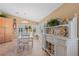 Cozy dining area with large windows and charming white decorative cabinet at 12432 Nova Ave, Port Charlotte, FL 33981