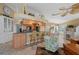 Open kitchen featuring a breakfast bar, pendant lighting, granite countertops, and views of the living room at 12432 Nova Ave, Port Charlotte, FL 33981