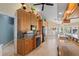 Kitchen featuring granite counters, black appliances, custom cabinets, eat-in area and tile floors at 12432 Nova Ave, Port Charlotte, FL 33981