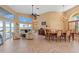 Spacious living area with water views, tile floors, a fireplace, and a formal dining room at 12432 Nova Ave, Port Charlotte, FL 33981