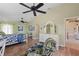 Spacious main bedroom with wood floors, a seating area, and a dresser with a mirror at 12432 Nova Ave, Port Charlotte, FL 33981