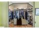 A walk-in closet with built-in shelving and ample storage space for clothes and shoes at 12432 Nova Ave, Port Charlotte, FL 33981