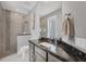 Bathroom includes granite counters, modern fixtures, and a gorgeous walk-in shower at 13379 Journal Ln, Port Charlotte, FL 33981