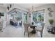Charming dining area features glass table and backyard view through the sliding glass doors at 13379 Journal Ln, Port Charlotte, FL 33981