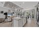 The kitchen features granite countertops, bar seating, stainless appliances and opens to the living space at 13379 Journal Ln, Port Charlotte, FL 33981