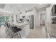 This kitchen features stainless appliances, granite countertops, and access to a dining area and backyard at 13379 Journal Ln, Port Charlotte, FL 33981