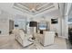 The open concept living space features neutral paint, tile floors, and a coffered ceiling design at 13379 Journal Ln, Port Charlotte, FL 33981