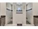 This shower room features dual walk-in showers with stone trim and seating at 13379 Journal Ln, Port Charlotte, FL 33981