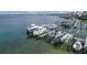 Scenic view of boat lifts at a marina showing boats resting above the calm, clear water at 1420 Beach Rd # 203, Englewood, FL 34223