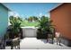 Charming courtyard view with seating and lush plants at 1420 Beach Rd # 203, Englewood, FL 34223