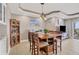 Comfortable dining area with bar-height table and chairs, adjacent to a well-appointed living space at 1420 Beach Rd # 203, Englewood, FL 34223