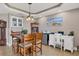 Inviting dining area with comfortable seating and a cabinet providing an intimate and stylish space at 1420 Beach Rd # 203, Englewood, FL 34223