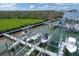 A picturesque marina with multiple boat lifts, surrounded by calm water and lush greenery at 1420 Beach Rd # 203, Englewood, FL 34223