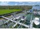 A picturesque marina with multiple boat lifts, surrounded by calm water and lush greenery at 1420 Beach Rd # 203, Englewood, FL 34223